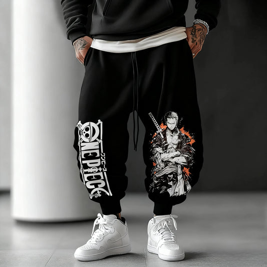 Spodnie dresowe One Piece – typograficzny wzór z postaciami (czarne)